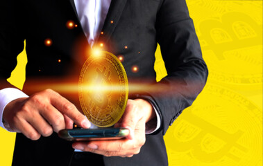 making money with bitcoin - Businessman creating bitcoins with his hand investment business target goal, media and technology for future concept