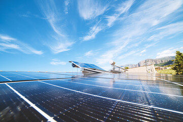 Renewable energy system with solar panel for electricity and hot water