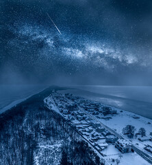 Milky way over winter Hel peninsula at night, Baltic Sea.