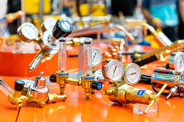 Pressure gauge regulator manometer and cylinder content capacity gauge and argon flow meter equipment for acetylene oxygen gas tig mig welding or cutting in industrial on table - obrazy, fototapety, plakaty