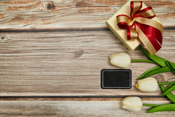 Gift And Tulip On The Wood