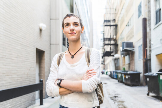 Confident young woman portrait in the city