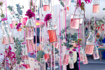Floral decor in glass vases bulbs hung