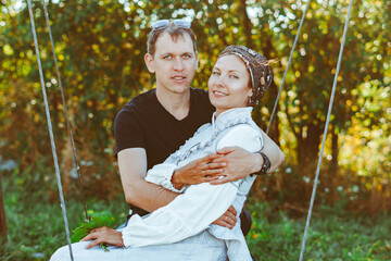 couple sitting on a swing