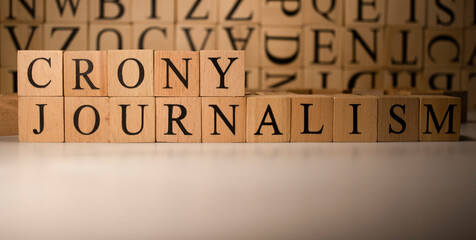 The word crony journalism was created from wooden cubes. Countries and politics