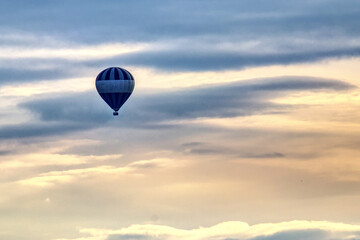 hot-air balloon against cloudy sky