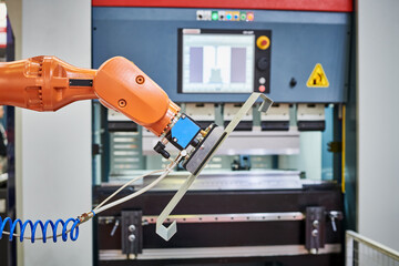Robot load-unload system for cnc hydraulic sheet bending machine. Automation and robotics in...