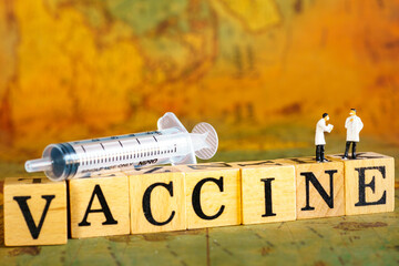 Healthcare and vaccine Consept. Group of doctor miniature figure people with patient file standing...