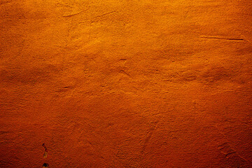 Orange colored abstract wall background with textures of different shades of orange and orange red