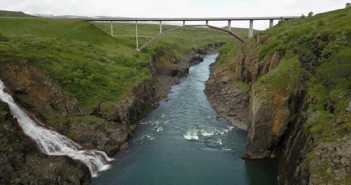 Iceland landscape beautiful river  and Bridge Aerial view
drone view from east Iceland landscape freen field with river, February 2021

