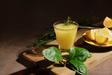 Italian alcoholic drink limoncello. Glass of limoncello liqueur and fresh lemons.