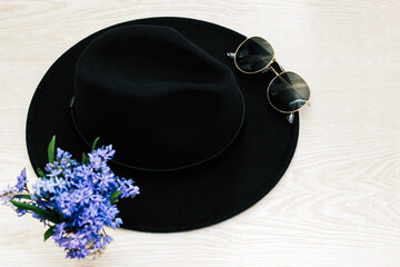 Flatley with black hat, glasses and flowers