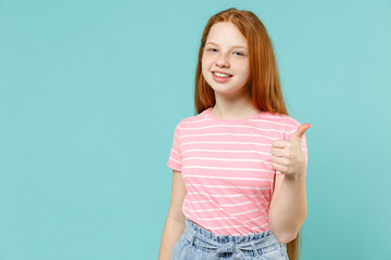Little happy satisfied redhead kid girl 12-13 year old wearing pink striped t-shirt show thumb up...