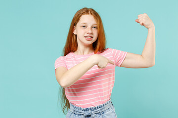Little strong sporty redhead kid girl 12-13 years old in pink t-shirt point finger biceps muscles...