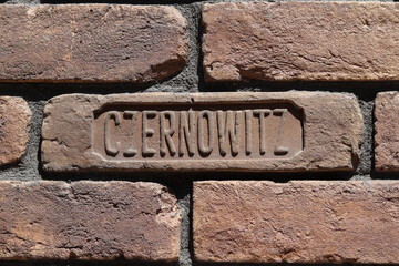 Inscription "Czernowitz" on the old brick wall. Czernowitz is the German name for the Ukrainian city of Chernivtsi.