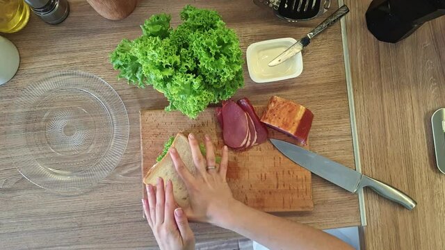 woman cooking sandwich at the kitchen overhead top view