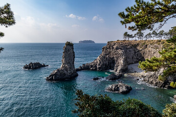Fototapeta na wymiar Jeju Island's strange rocks and blue sea