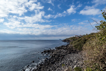 Fototapeta na wymiar The scenery of Jeju Island with blue sea and sky
