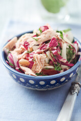 Salad with tuna, tomatoes and cucumber. Wooden background. Close up.	