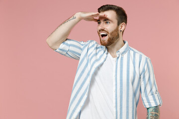 Young smiling happy caucasian unshaven man 20s wear blue striped shirt white t-shirt hold hand at...