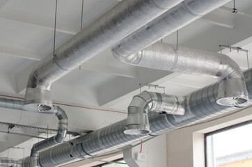 Air conditioning of buildings. System of industrial ventilating pipes. Background of ventilation...