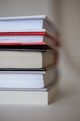 stack of different books with a side on a white background.
