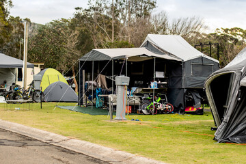 Camper trailers camping at the holiday caravan park. Family vacation travel concept