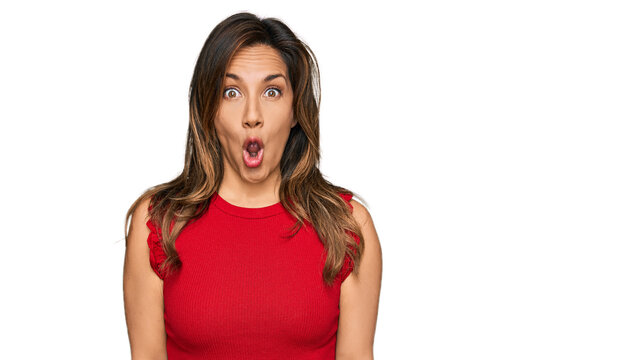 Young hispanic woman wearing casual clothes afraid and shocked with surprise expression, fear and excited face.