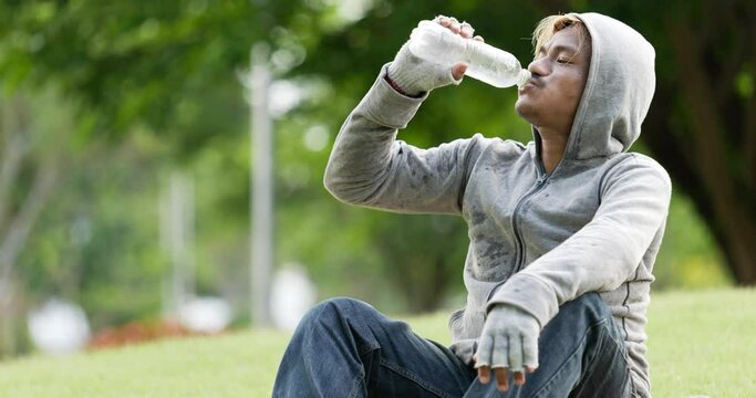 Homeless man drinking water