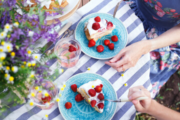girls eating cake in the garden