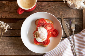 Toast with tomatoes and egg Benedict. Top view