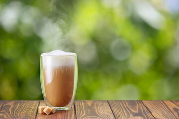 cappuccino in glass with double walls on table