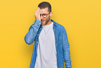 Young caucasian man wearing casual clothes yawning tired covering half face, eye and mouth with hand. face hurts in pain.