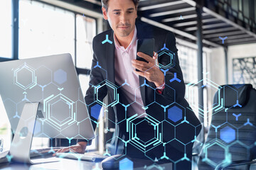 Businessman in suit using smart phone to optimize development by implying new technologies in business process. Interconnections and hi tech hologram over modern panoramic office background.