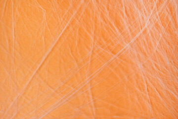White spider's net on orange background. concept of halloween