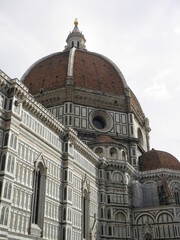 Fototapeta na wymiar Cathedral of Santa Maria del Fiore. Huge dome and parts of church with intricate designs and 