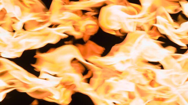Counter Fire Opal. Two bright intense streams of fire move towards each other on a black background. Slow Motion 240 fps