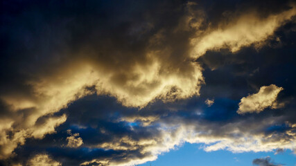 the reflection of the setting sun on the clouds at sunset