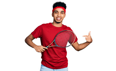 Young african american man wearing tennis player uniform smiling happy pointing with hand and finger