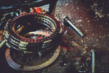Close-up of motorcycle engine clutch system in maintenance checks.
