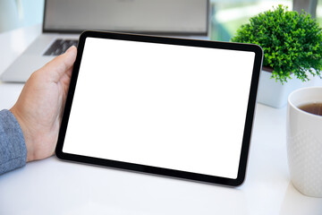 male hand holding computer tablet with isolated screen in office