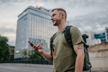 handsome hipster man walking in street