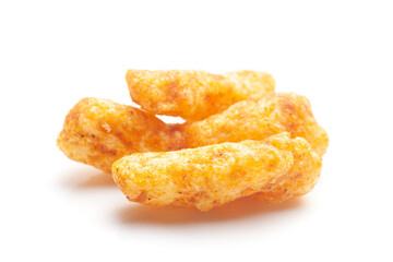 Close up of tangy Potato Puff Snacks sticks, Popular Ready to eat crunchy and puffed snacks sticks tangy spicy  orange color over white background