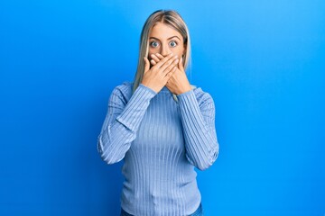 Beautiful blonde woman wearing casual clothes shocked covering mouth with hands for mistake. secret concept.