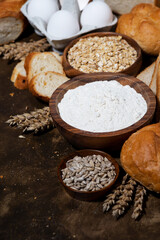 assortment of baked goods and fresh bread, vertical closeup