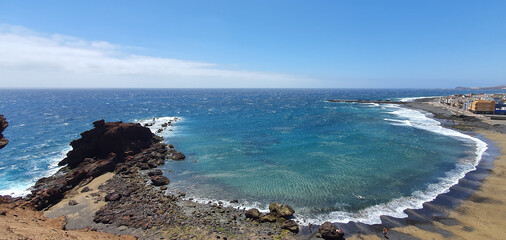 rocky beach on the blue sea
