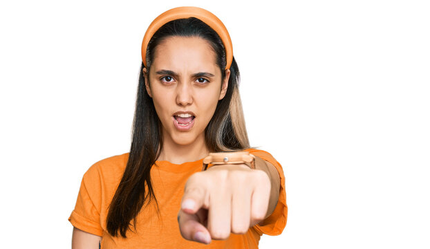 Young hispanic woman wearing casual clothes pointing displeased and frustrated to the camera, angry and furious with you