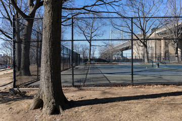 Outside a Fenced In Empty Tennis Court at Astoria Park in Astoria Queens New York