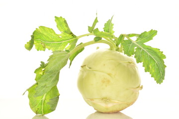 One ripe organic kohlrabi cabbage, close-up, isolated on white.