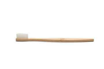 Bamboo toothbrush isolated on a white background.